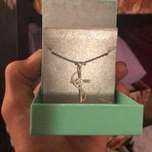 Fine silver plated cross pendant and chain.